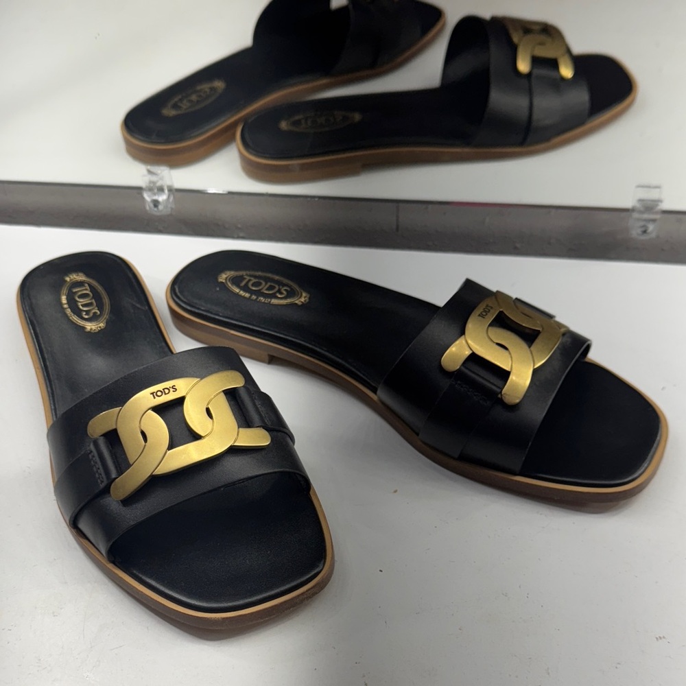 Tod's Elegant Black and Gold Women's Sandals